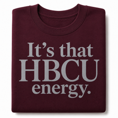 Folded maroon crewneck with It's that HBCU energy in grey lettering