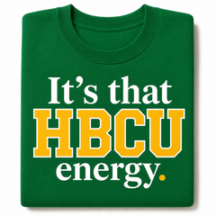 Folded green crewneck with It's that HBCU energy in gold and white lettering