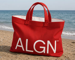 Red ALGN canvas beach tote with white logo